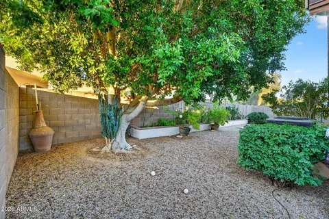 a view of house with a yard
