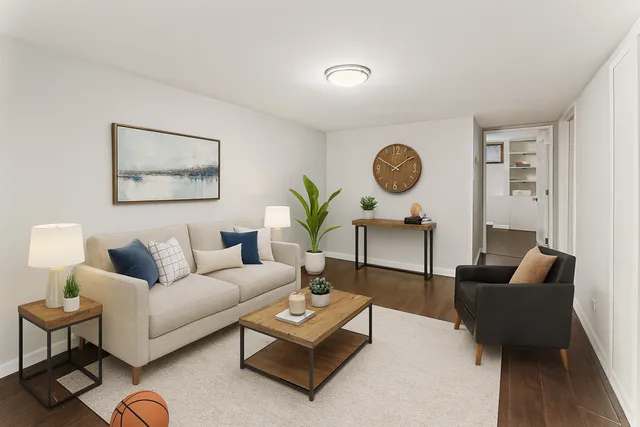 a view of a room with wooden floor