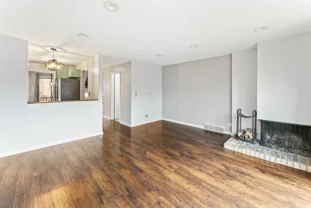 a view of a livingroom with wooden floor