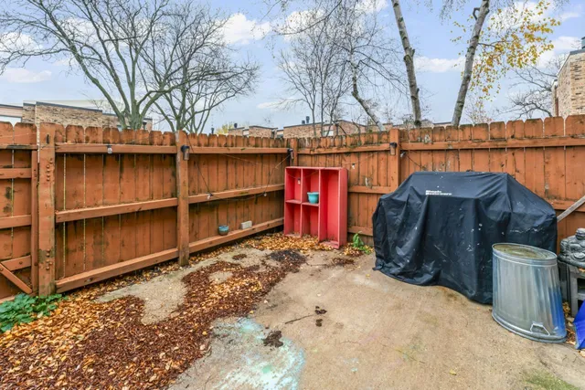 front view of a brick house with a large windows