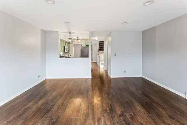 a view of a kitchen with wooden floor