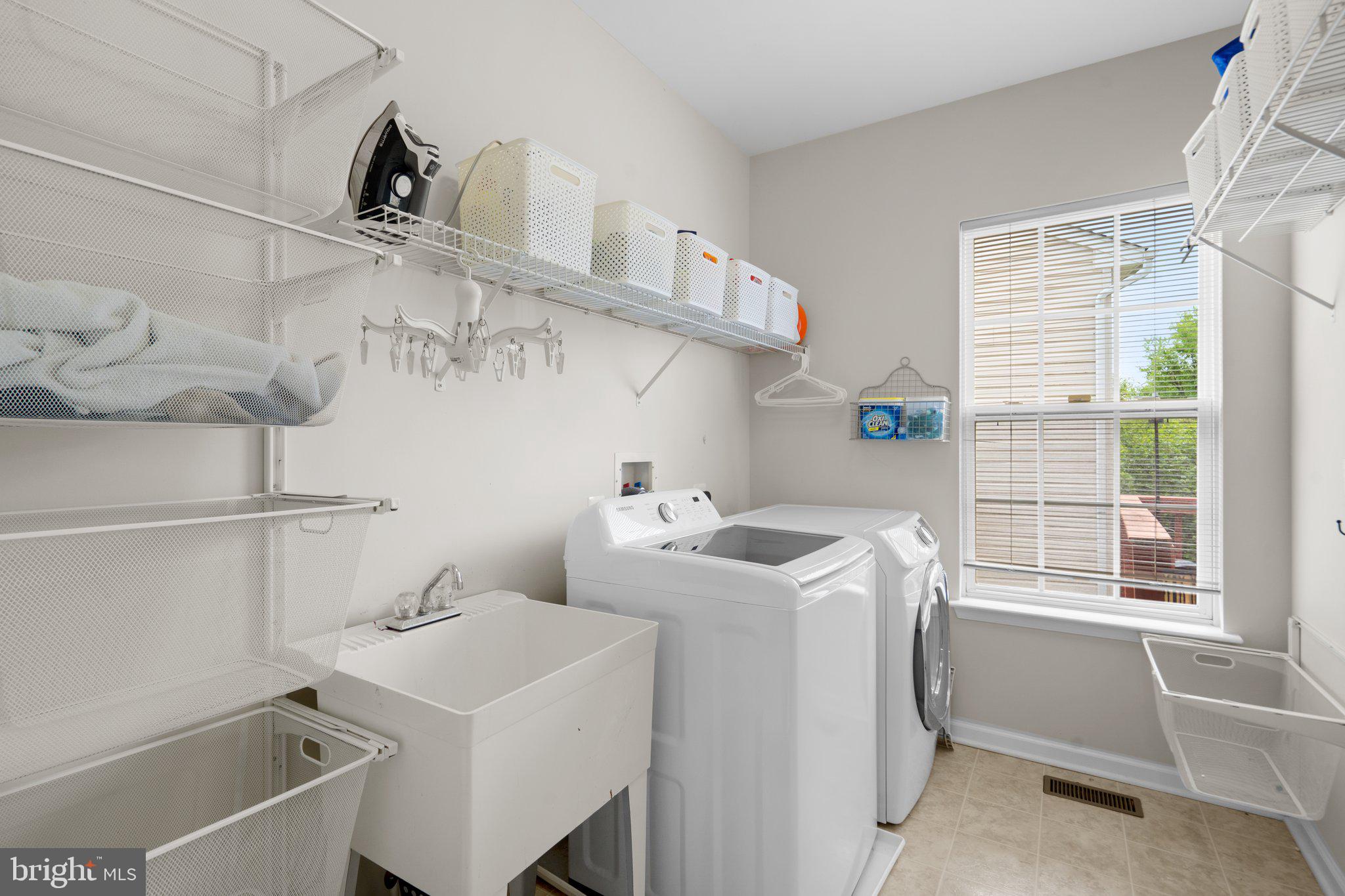 14334 Ashleigh Greene Road Boyds, MD 20841 - Photo 27 of 63 Main-Level Laundry Room