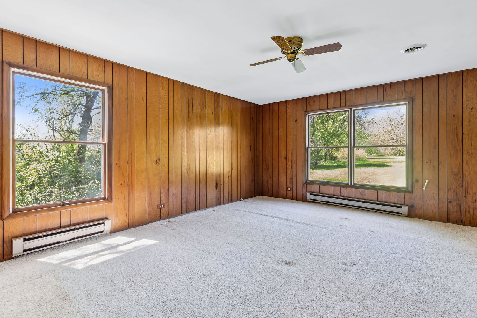 18054 South Parker Road Mokena, IL 60448 - Photo 14 of 21 an empty room with windows and a ceiling fan