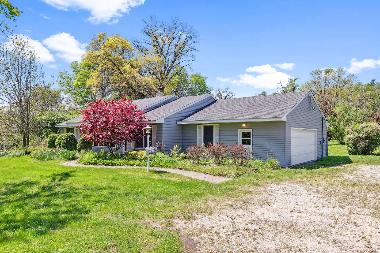 18054 South Parker Road Mokena, IL 60448 - Photo 2 of 21 a front view of a house with garden