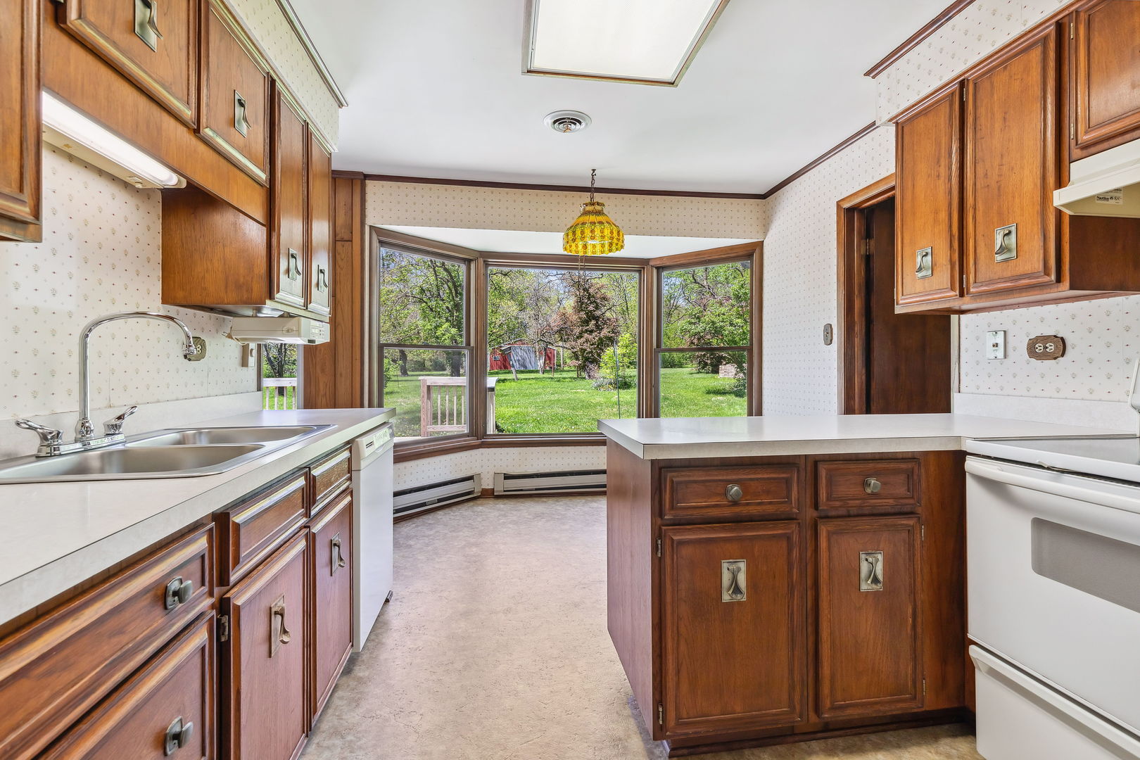 18054 South Parker Road Mokena, IL 60448 - Photo 7 of 21 a kitchen with a sink and a large window
