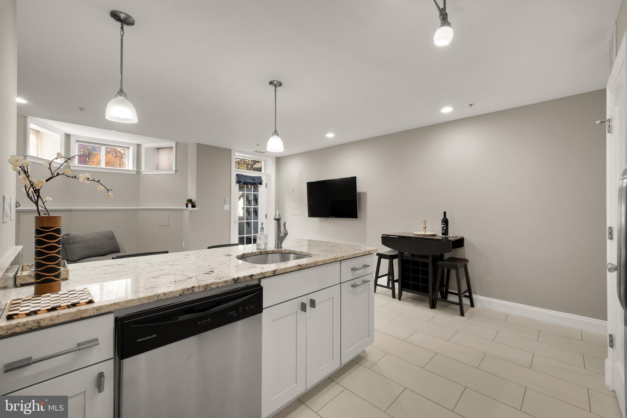 1135 6th Street Northwest, Unit 1 Washington, DC 20001 - Photo 15 of 33 a kitchen with a sink cabinets and window