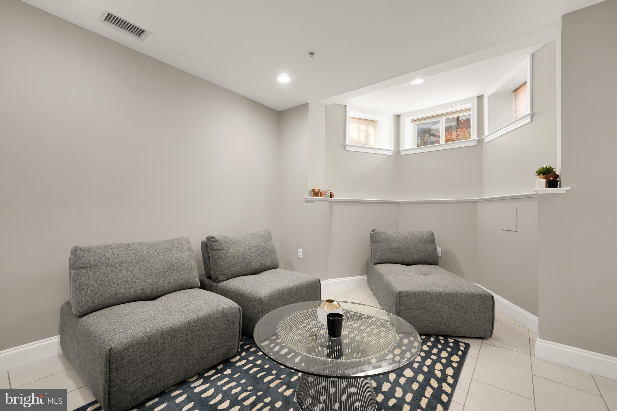 1135 6th Street Northwest, Unit 1 Washington, DC 20001 - Photo 4 of 33 a living room with furniture and a rug