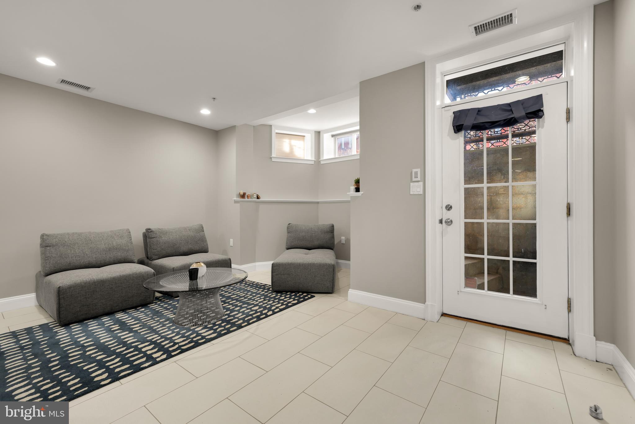 1135 6th Street Northwest, Unit 1 Washington, DC 20001 - Photo 5 of 33 a bedroom with furniture and a window