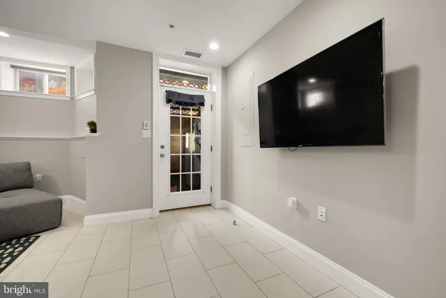 a view of livingroom with furniture and flat screen tv
