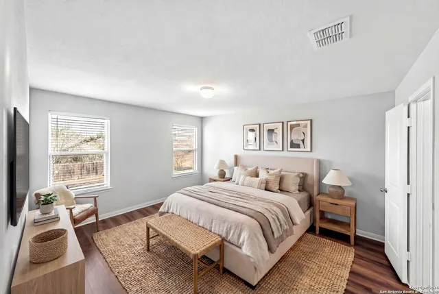 a bedroom with a bed and a couch