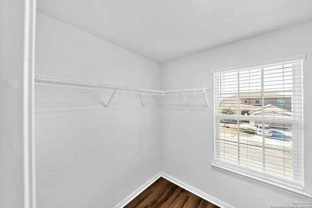 a view of a small space with racks on the wall