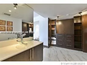 a bathroom with a sink double vanity and a shower