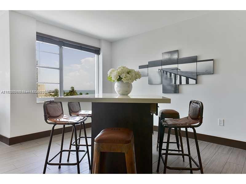 5255 Collins Avenue, Unit 4G Miami Beach, FL 33140 - Photo 3 of 30 a dining room with furniture and window