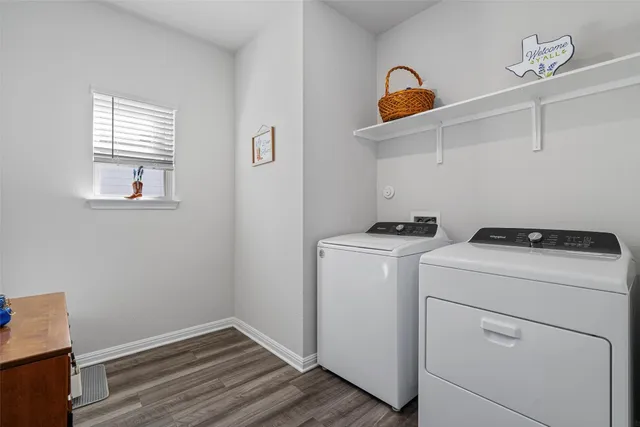 a view of storage and utility room with washer and dryer