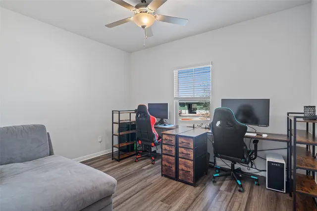 a bedroom with a workspace
