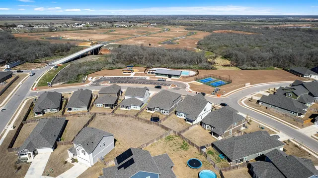 an aerial view of a houses with outdoor space