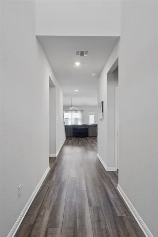 a view of gallery with wooden floor