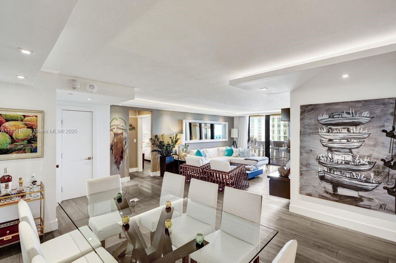 1121 Crandon Boulevard, Unit D706 Key Biscayne, FL 33149 - Photo 11 of 47 a living room with furniture and a flat screen tv