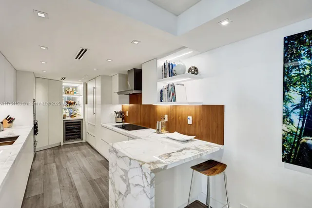 a large white room with a large bed and a couch