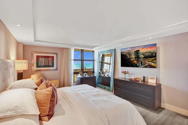 a bed room with a bed and a television