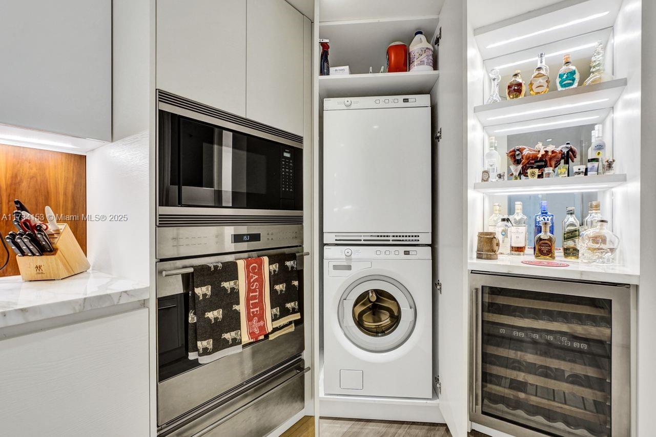 1121 Crandon Boulevard, Unit D706 Key Biscayne, FL 33149 - Photo 32 of 47 a utility room with closet dryer and washer