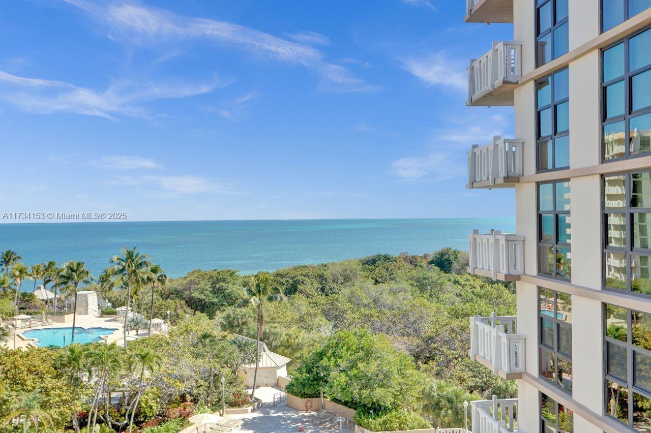 1121 Crandon Boulevard, Unit D706 Key Biscayne, FL 33149 - Photo 33 of 47 a view of a lake with a building in the back