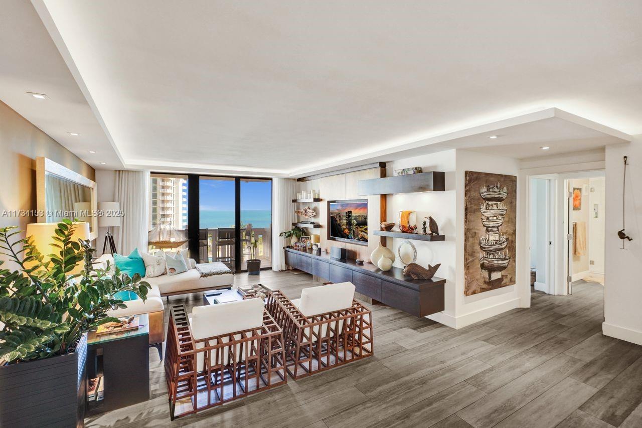 1121 Crandon Boulevard, Unit D706 Key Biscayne, FL 33149 - Photo 5 of 47 a living room with furniture and a large window