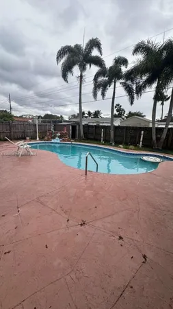 a view of outdoor space with swimming pool