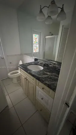 a view of an empty room and a window