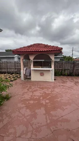 a view of a house next to a yard