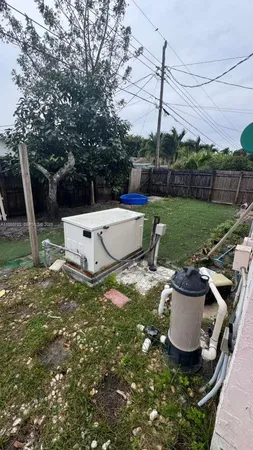 a view of a backyard with sitting area and slide