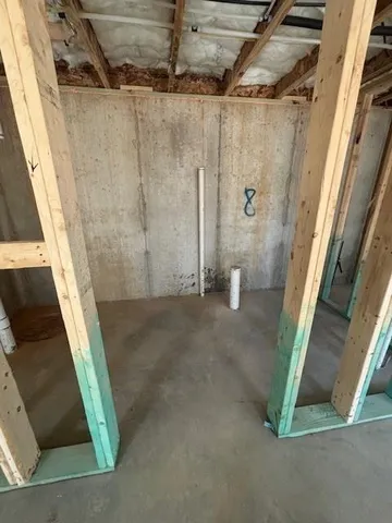 a view of empty room with windows