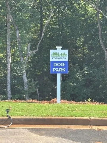a view of a yard with large trees