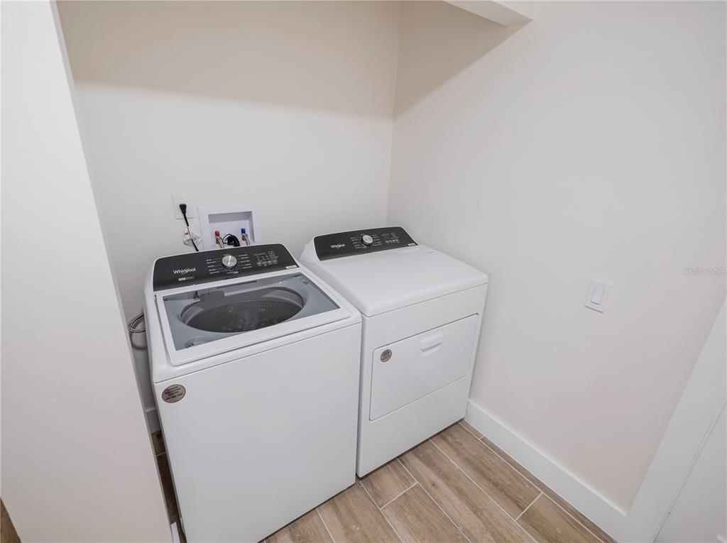 6790 Edgeworth Drive Orlando, FL 32819 - Photo 37 of 57 a utility room with dryer and washer