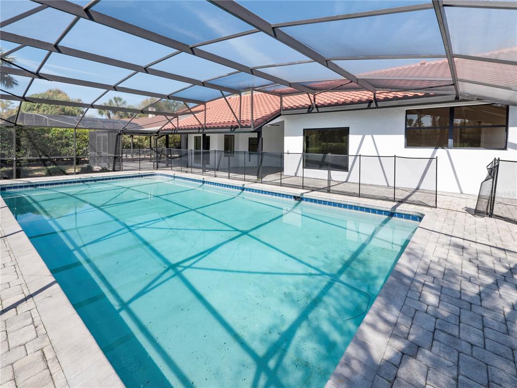 6790 Edgeworth Drive Orlando, FL 32819 - Photo 42 of 57 a view of a chairs and table in a patio