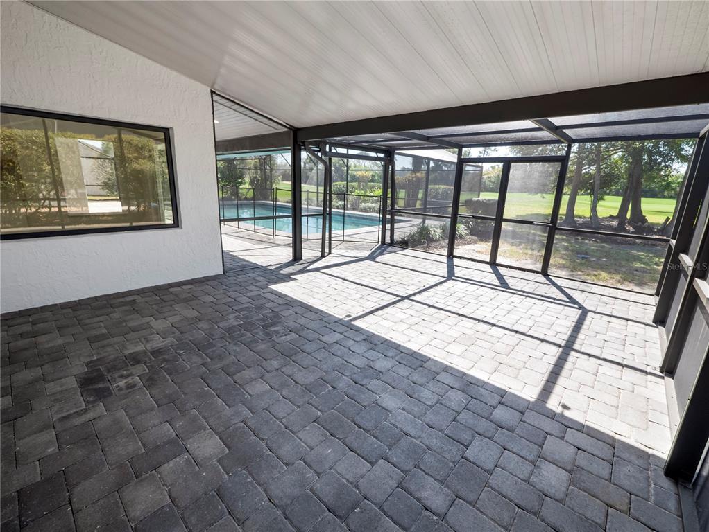 6790 Edgeworth Drive Orlando, FL 32819 - Photo 46 of 57 a view of an empty room with a large window