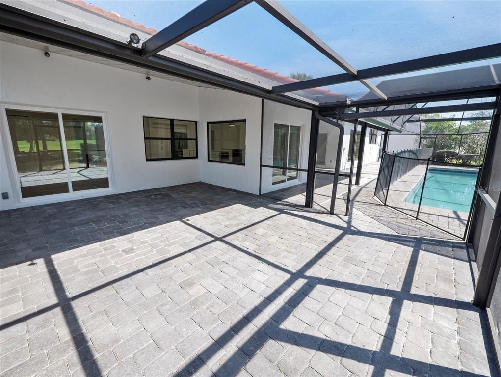 6790 Edgeworth Drive Orlando, FL 32819 - Photo 47 of 57 a view of porch with a lounge chair