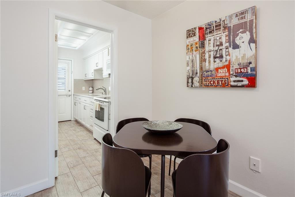 72 7th Street South, Unit 208 Naples, FL 34102 - Photo 5 of 10 a kitchen with a sink and cabinets