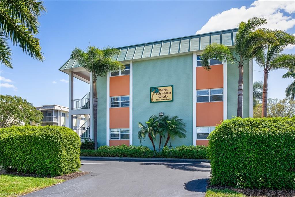 72 7th Street South, Unit 208 Naples, FL 34102 - Photo 9 of 10 a front view of a house with garden