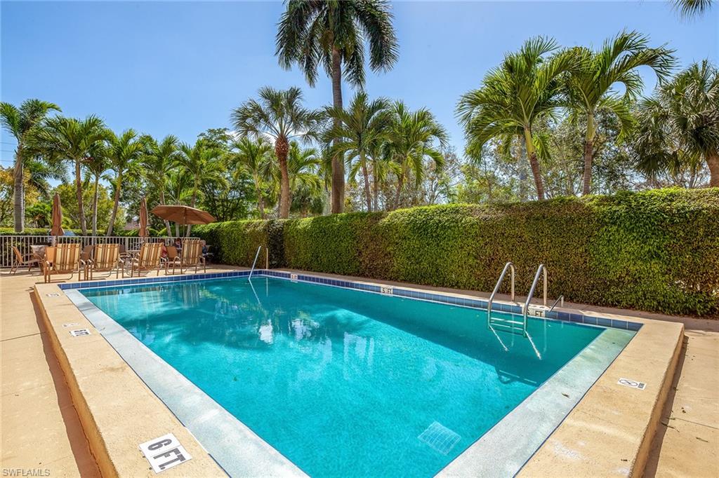 72 7th Street South, Unit 208 Naples, FL 34102 - Photo 10 of 10 a view of a swimming pool with a yard