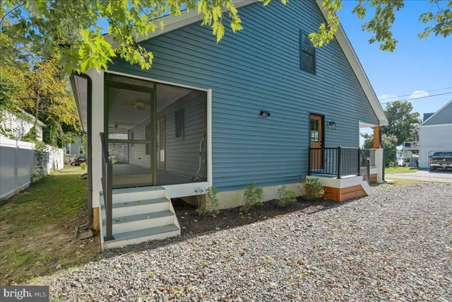 an aerial view of a city with lots of residential buildings and ocean view