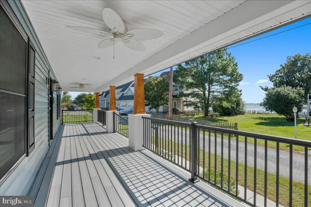a view of a porch with wooden floor and outdoor space