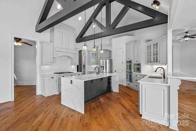 a view of an empty room with window and cabinet