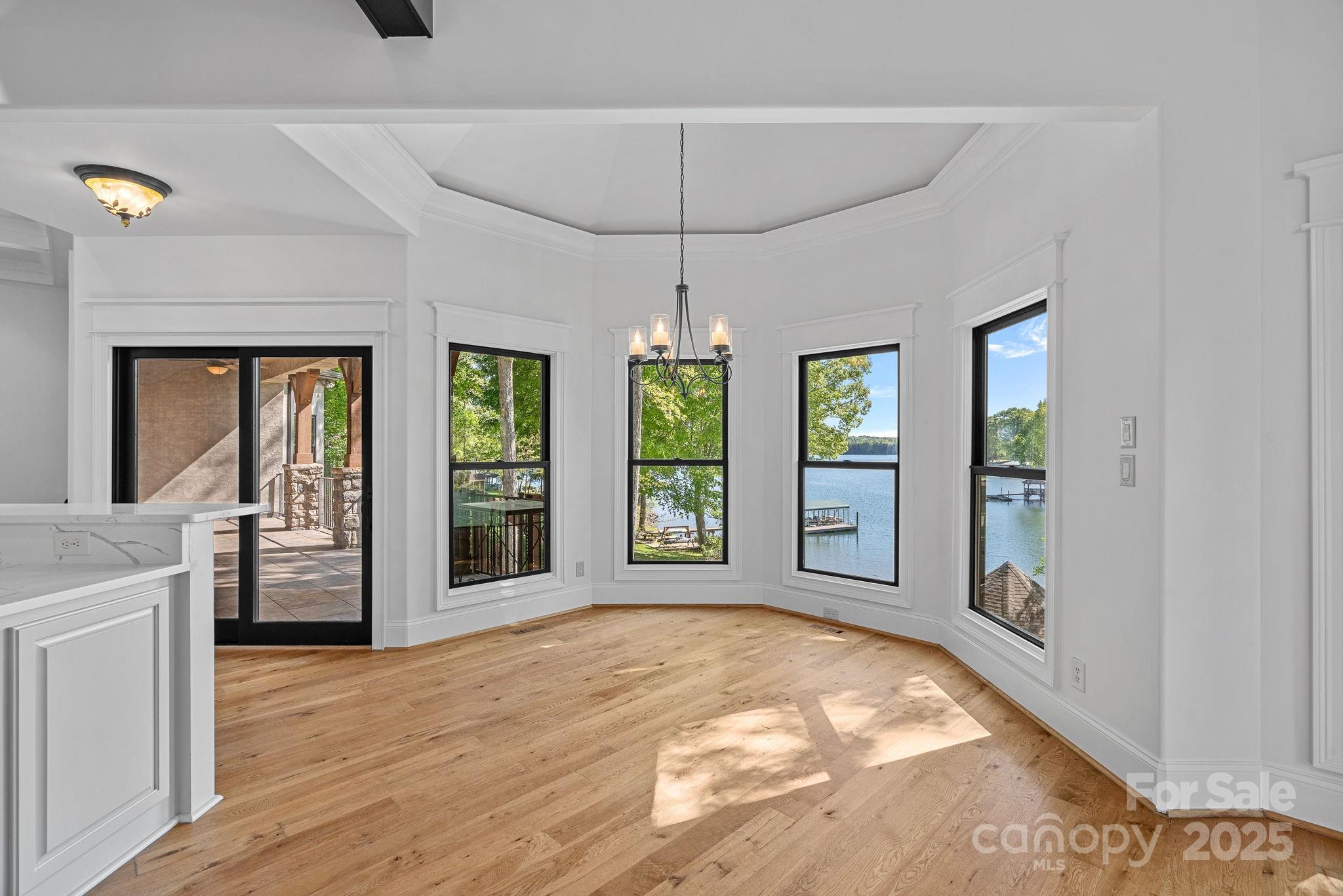 4786 Heather Lane Denver, NC 28037 - Photo 13 of 48 a view of an empty room with window and cabinet