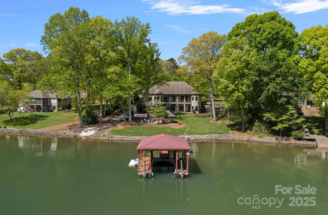 a swimming pool with outdoor seating and yard