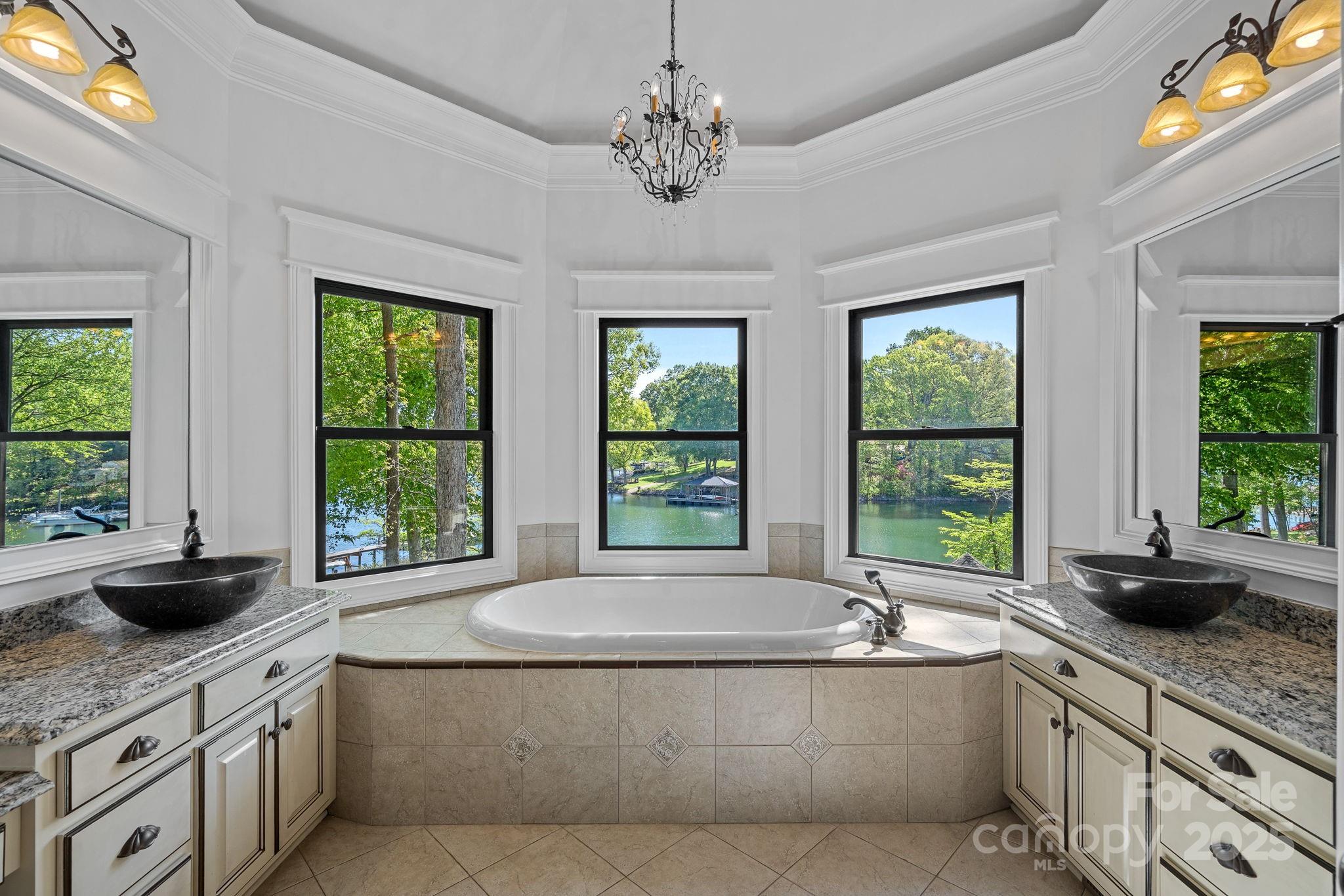 4786 Heather Lane Denver, NC 28037 - Photo 21 of 48 a living room with granite countertop a swimming pool and a large window
