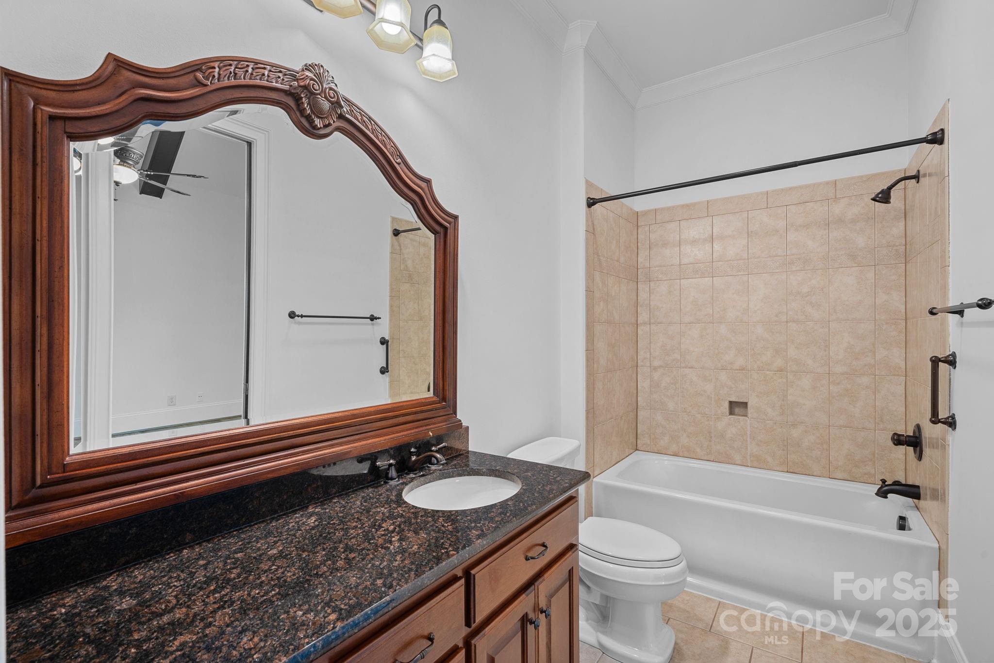 4786 Heather Lane Denver, NC 28037 - Photo 25 of 48 a bathroom with a sink a toilet and a mirror