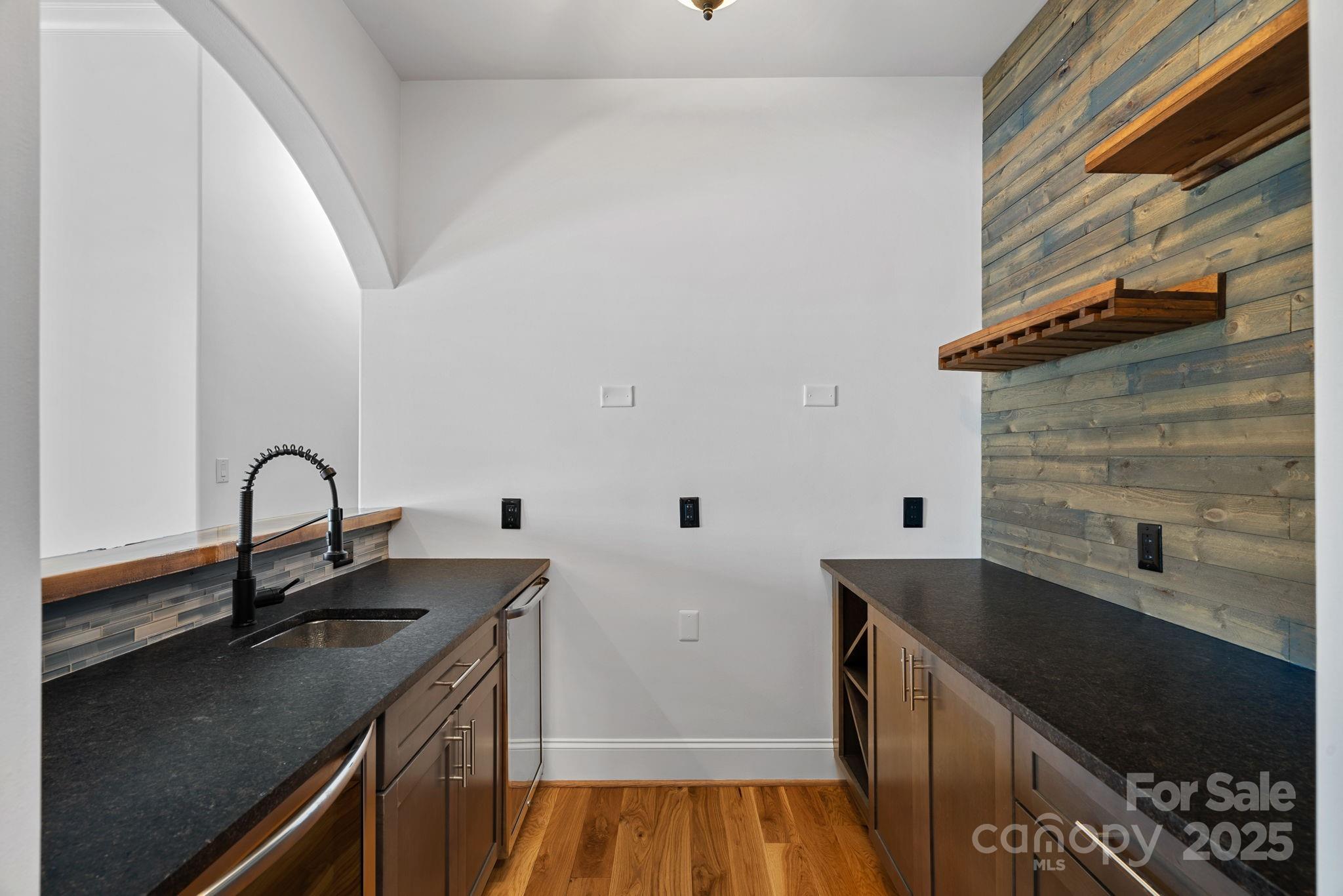 4786 Heather Lane Denver, NC 28037 - Photo 26 of 48 a kitchen with a sink and cabinets