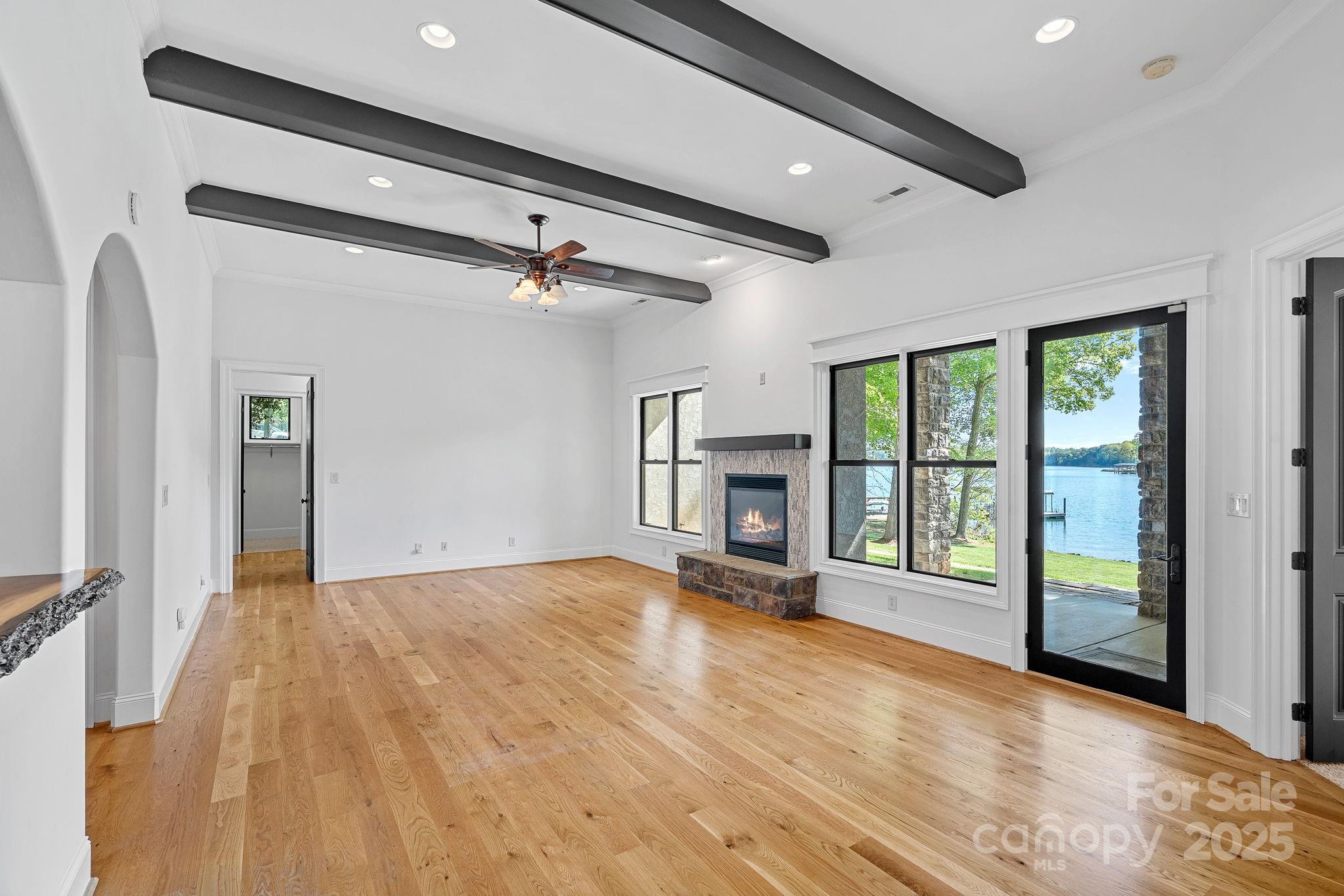 4786 Heather Lane Denver, NC 28037 - Photo 28 of 48 a view of an empty room with wooden floor and a window