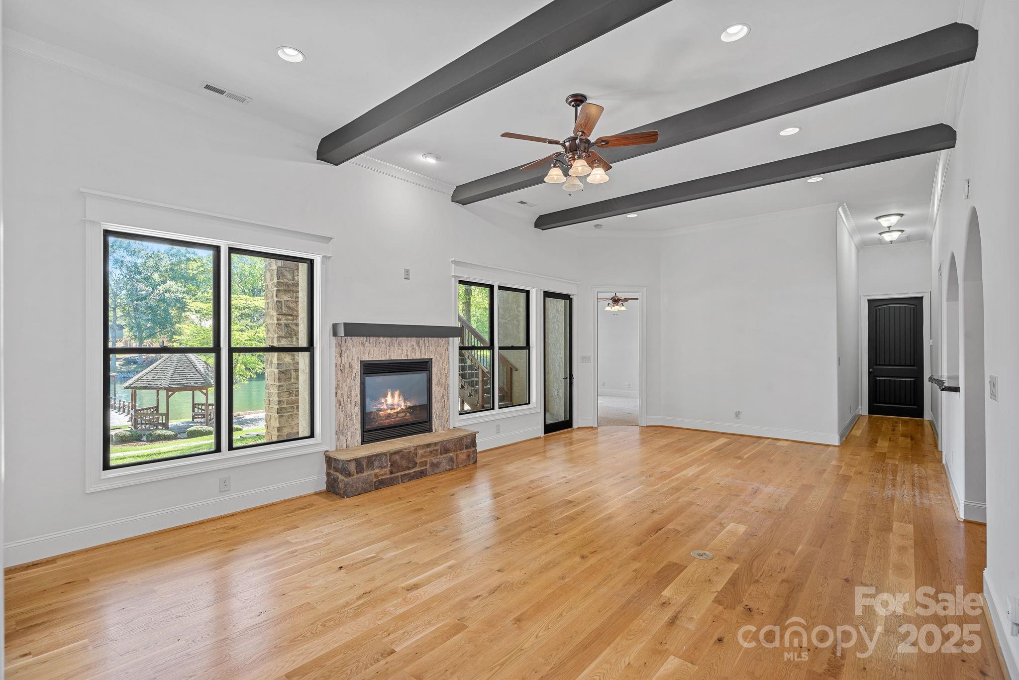 4786 Heather Lane Denver, NC 28037 - Photo 29 of 48 a view of an empty room with a fireplace and a window